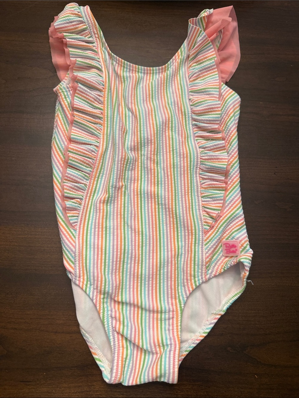 RuffleButts Pastel Rainbow Striped One-Piece Swimsuit with Pink Ruffles